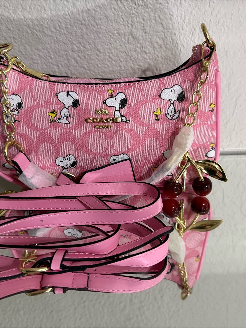 Coach Pink Snoopy Print Crossbody with Cherry Charm